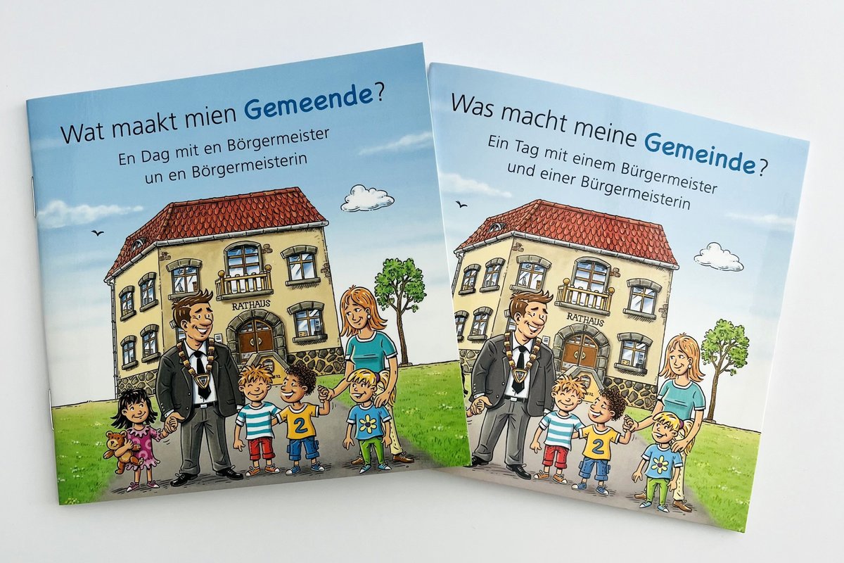 Zu sehen sind die Kinderbücher "Was macht meine Gemeinde?" und "Wat maakt mien Gemeende?"